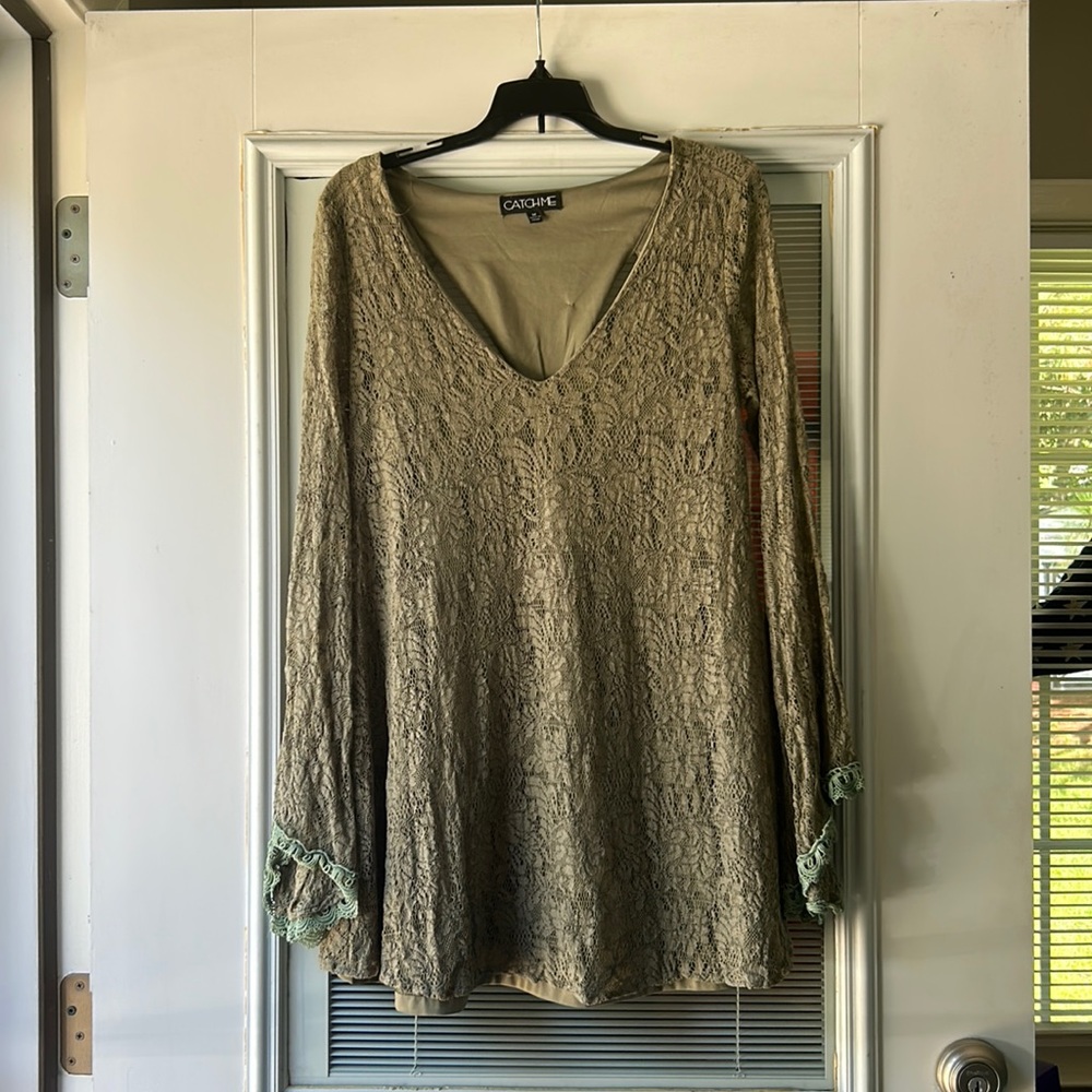 Forest green mini dress with lace bell sleeves, cut out back